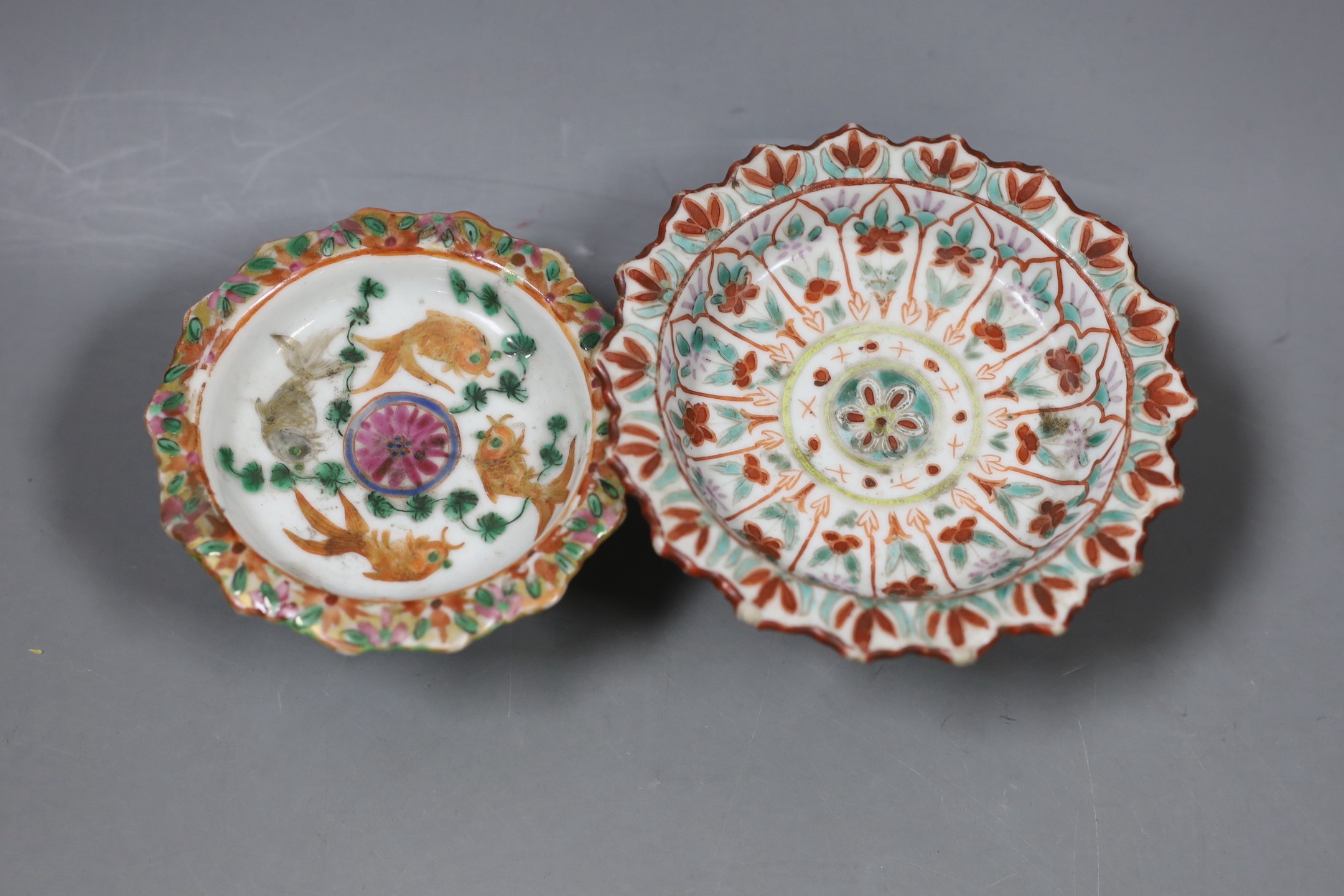 A Chinese Straits enamelled porcelain stem dish, together with a smaller footed koi famille rose stem dish, both late 19th/early 20th century, Largest 12cm diameter